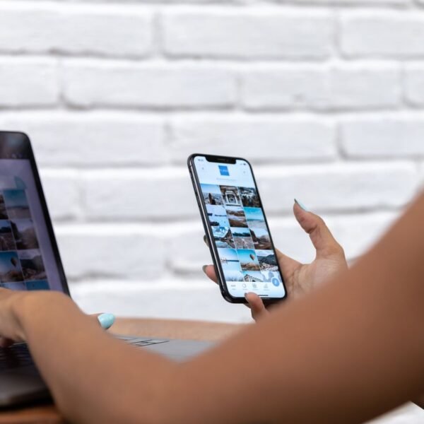 Small business owner scheduling social media posts on a laptop