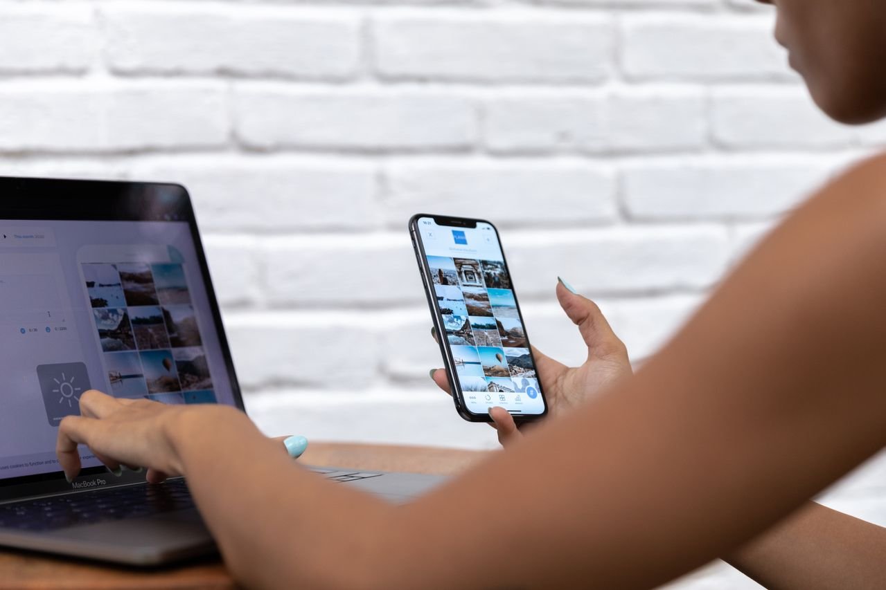 Small business owner scheduling social media posts on a laptop